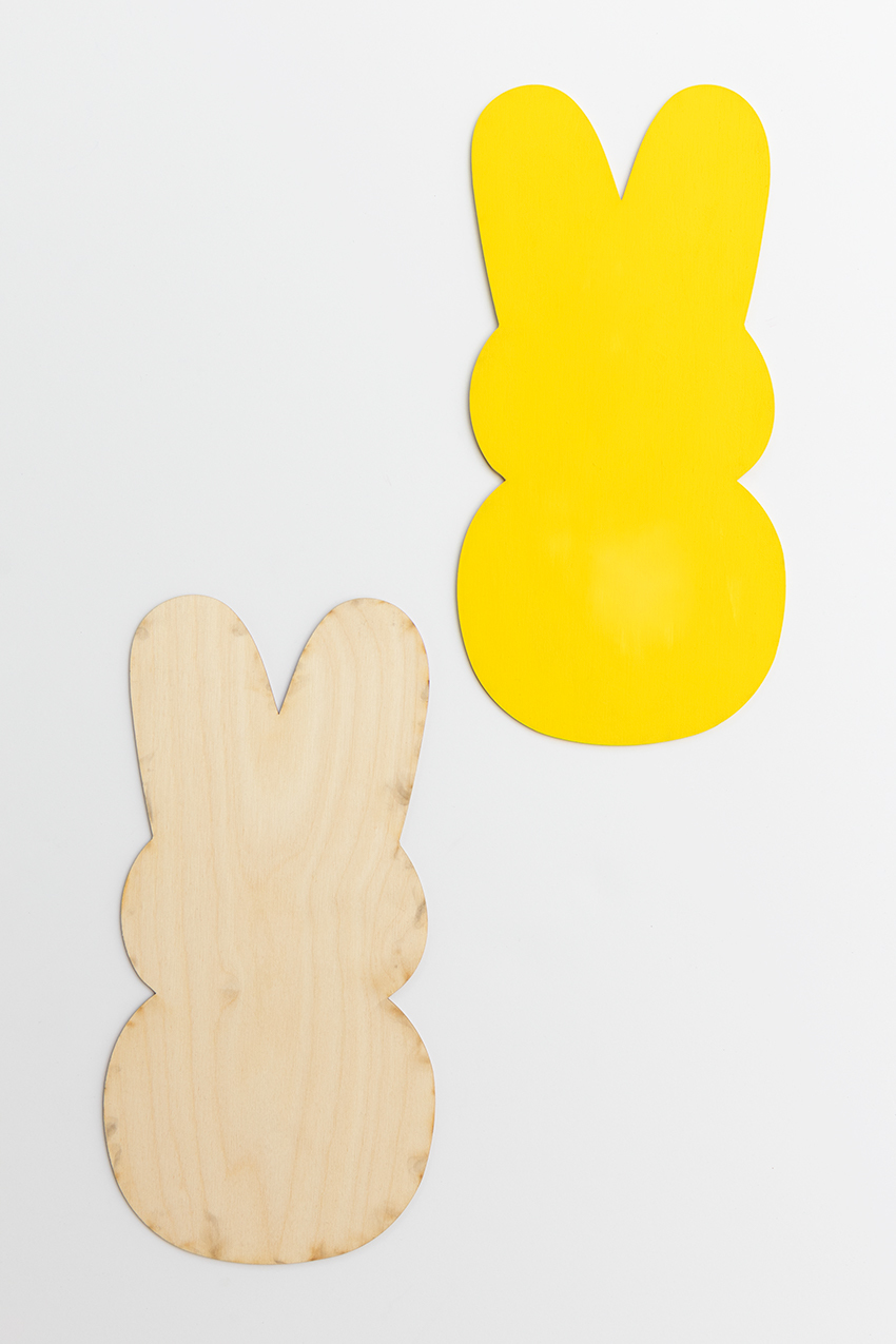 Painting a wooden peep.